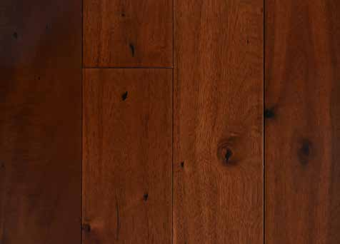 A close-up of aAsian Walnut 122x400-1200 mm Solid Wood Floor - 18 mm (Random Sizes) available at Material Depot in Bangalore