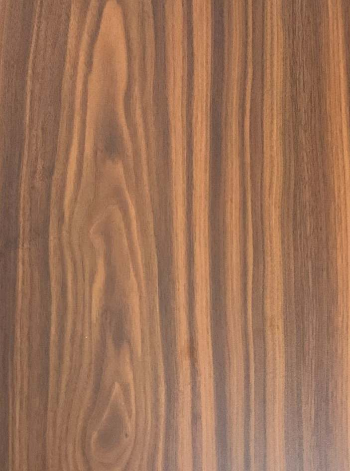 A close-up of a Brown SF 1421 American Walnut with a Suede finish Decorative Laminate available at Material Depot in Bangalore