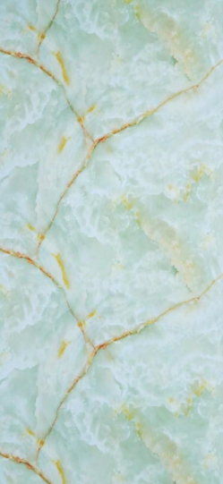 A close-up of a Green Opera Green with a Glossy finish Decorative Laminate available at Material Depot in Bangalore
