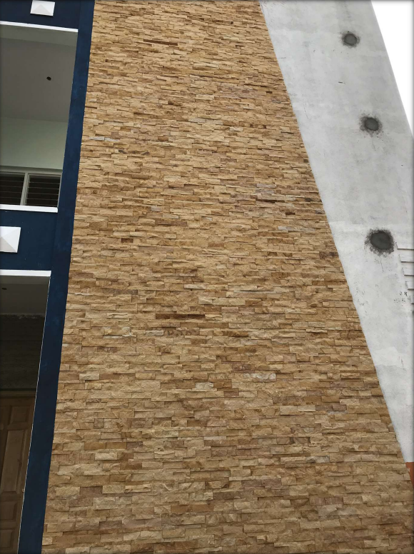 A close-up of a 1002 Yellow Sand Stone 609.6x152.4 mm Wall Cladding available at Material Depot in Bangalore