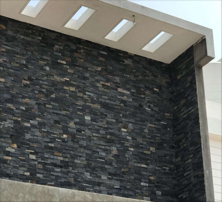 A close-up of a 1010 Carban Black Stone 609.6x152.4 mm Wall Cladding available at Material Depot in Bangalore