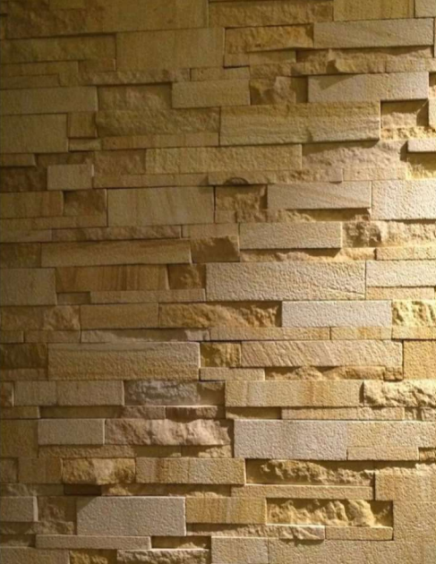 A close-up of a 1048 Teak Sand Rockface 609.6x152.4 mm Wall Cladding available at Material Depot in Bangalore