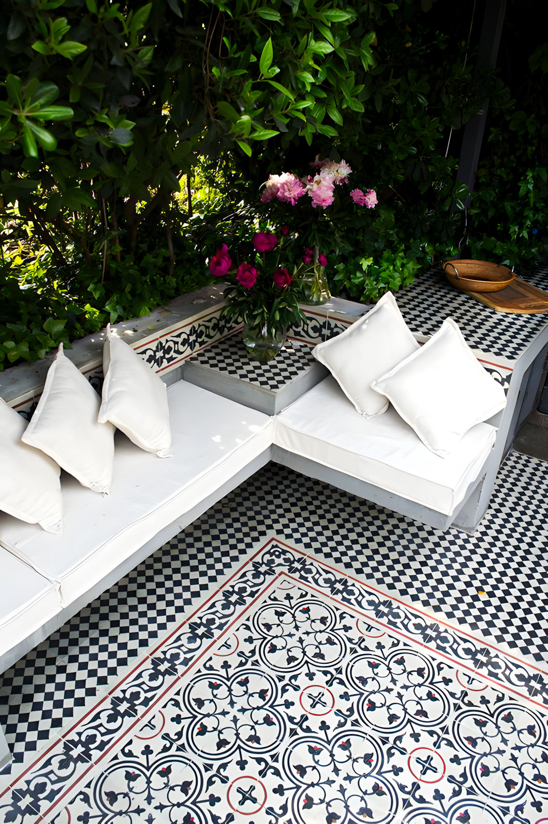 Cozy Patio with Patterned Tiles and Outdoor Seating | Material Depot