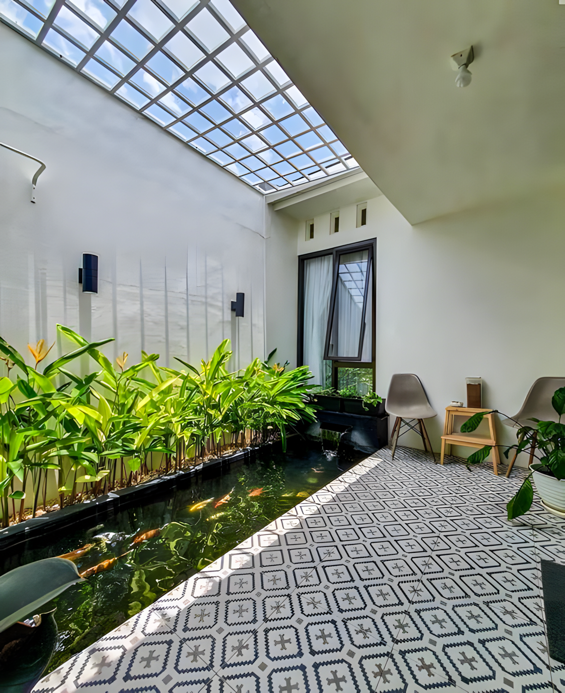 Modern Courtyard with Fish Pond and Patterned Tiles | Material Depot