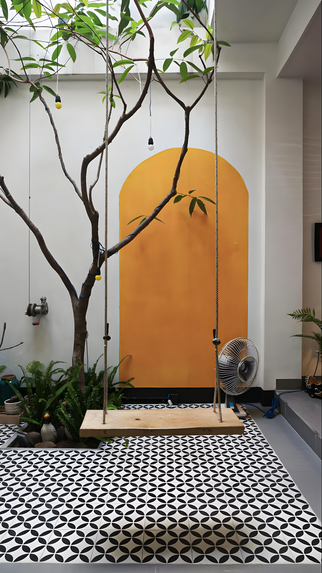 Modern Courtyard with Yellow Accent Wall and Patterned Tiles | Material Depot