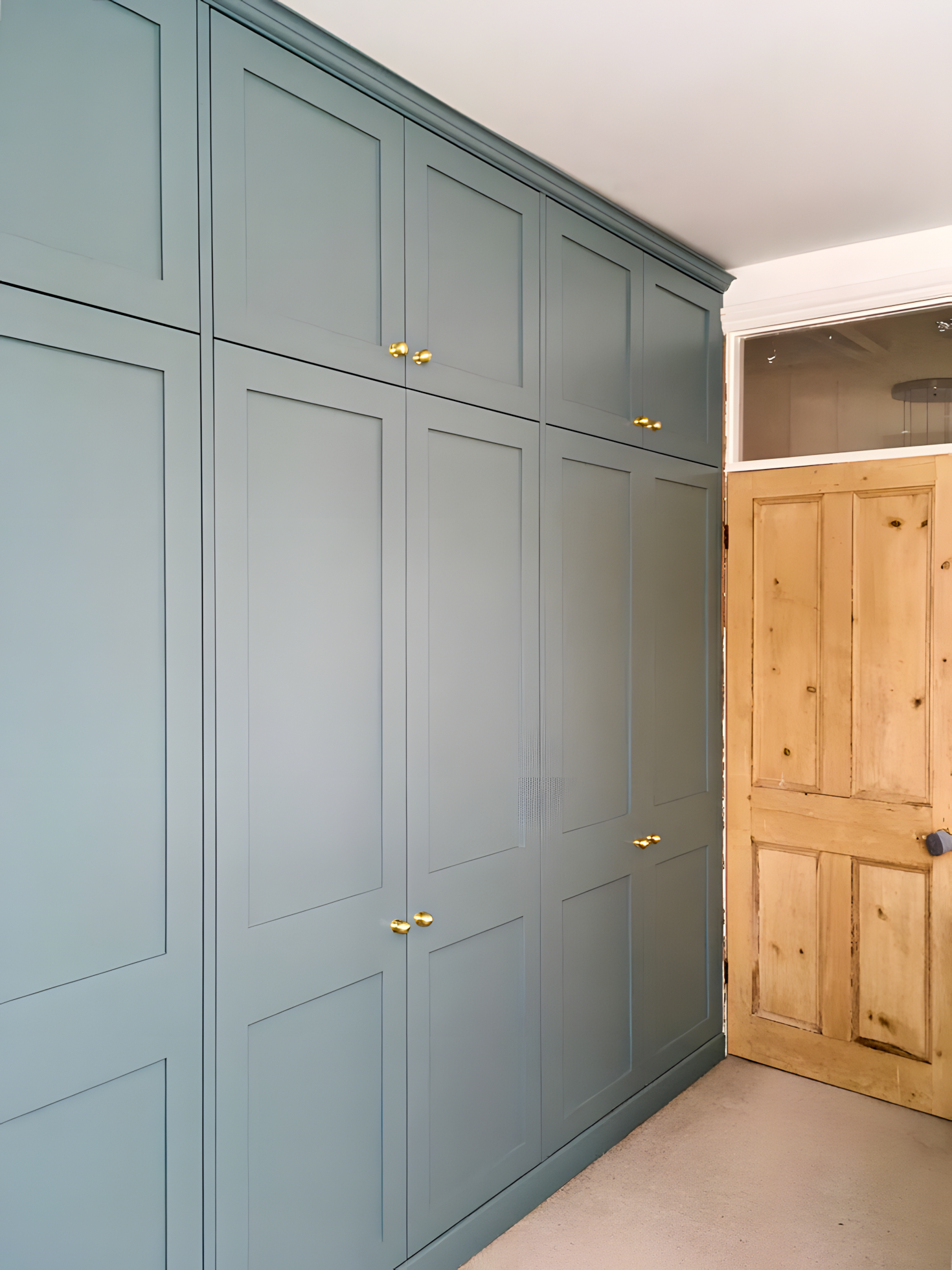 Serene Bedroom with Teal Painted Wardrobe and Brass Hardware | Material Depot